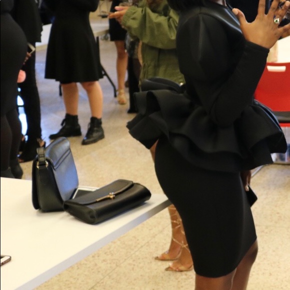 All black, formal custom made blouse and skirt.